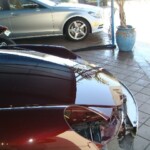 Before and after photographs of a damaged Porsche that was repaired by Elite Paint & Body Shop in West Palm Beach, Florida.
